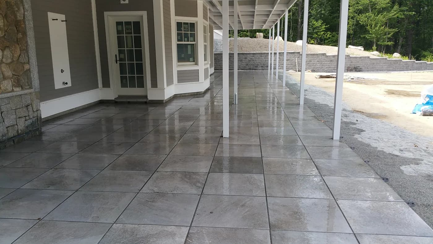 Large bluestone patio alongside a home