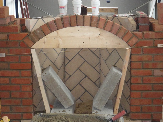 Building a masonry arch for an interior fireplace