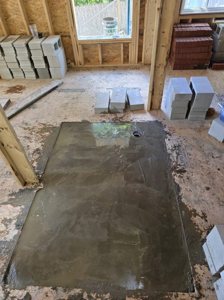 concrete is leveled to the top, needs to set then building can continue
