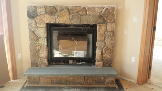 original brick fireplace before stone veneer transformation