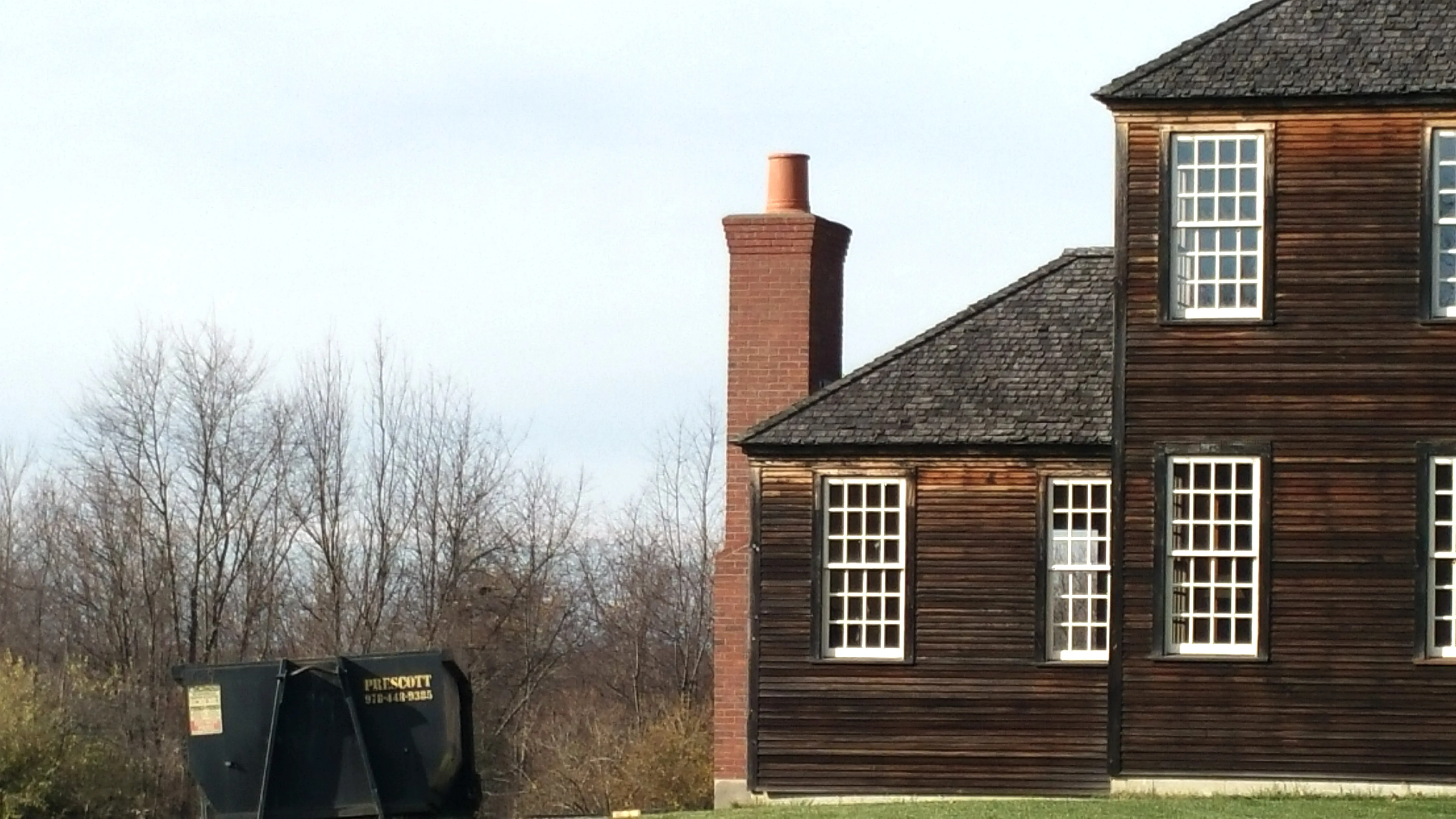Red-brick chimney on a historic home served by JB Mohler Masonry in Berlin, MA